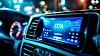 car dashboard display showing over-the-air (ota) firmware update in progress, modern automotive technology and connectivity
