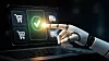 Roboterhand berührt ein digitales Zahlungssymbol auf einem Laptop-Bildschirm.