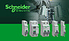Schneider-Electric-Schutzgeräte der Easy9-Pro-Serie sind auf einer grünen Fläche vor einer elektrischen Verteilung zu sehen.
