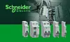 Schneider-Electric-Schutzgeräte der Easy9-Pro-Serie sind auf einer grünen Fläche vor einer elektrischen Verteilung zu sehen.