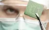 Scientist examining a microchip.