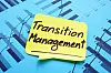 Klebezettel mit der Aufschrift Transition Management klebt auf Statistiken