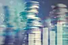 Double exposure of city and graph on rows of coins for finance a