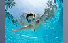 Underwater Young Boy Fun in the Swimming Pool with Goggles