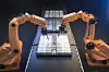 Robot assembly line with electric car battery cells module on platform