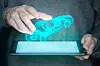 Concept image of a tablet who projects a car