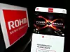 Stuttgart, Germany - 12-04-2022: Person holding cellphone with website of Japanese electronics company Rohm Semiconductor on screen with logo. Focus on center of phone display.