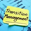 Klebezettel mit der Aufschrift Transition Management klebt auf Statistiken